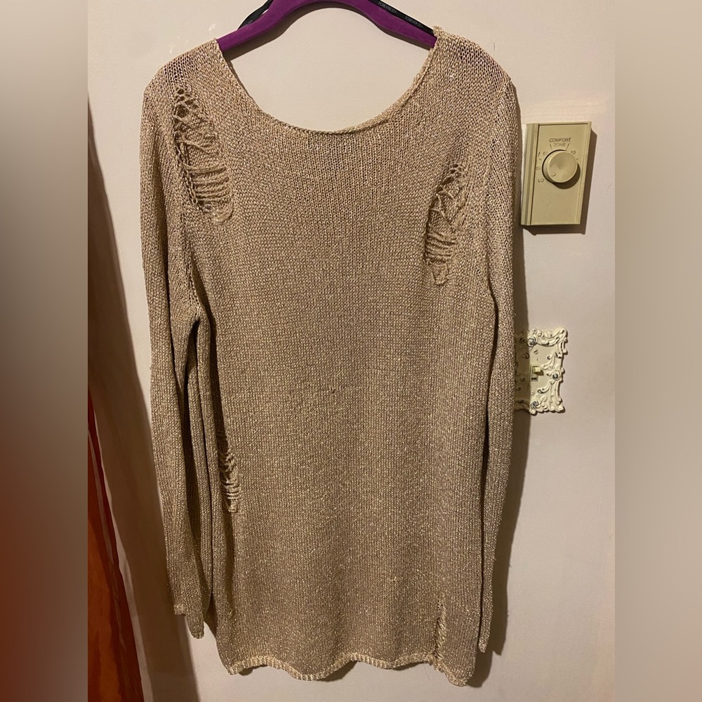Gold and sparkle embellishments, distressed styles, long can be a dress or top